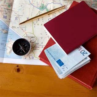 desk with map and passport on it. 
