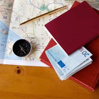 desk with map and passport on it.
