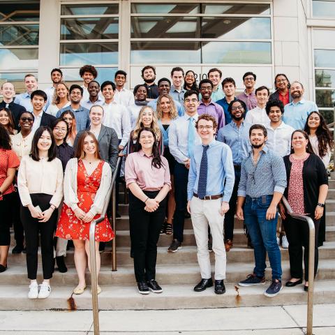 2022 CanSUR undergraduates smiling and posing on the steps outside the Wolstein Research Building