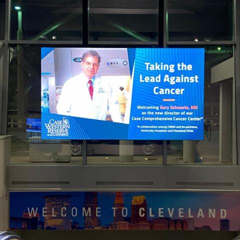 a sign at Cleveland Hopkins Airport welcoming Dr. Gary Schwartz to the cancer center