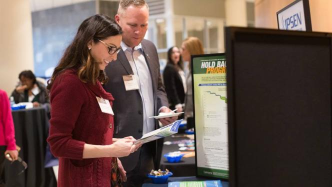 Image of vendors talking to people at the 2018 Cancer Disparities Symposium
