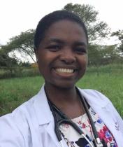 Portrait of Tonjeh M Bah outside in whitecoat