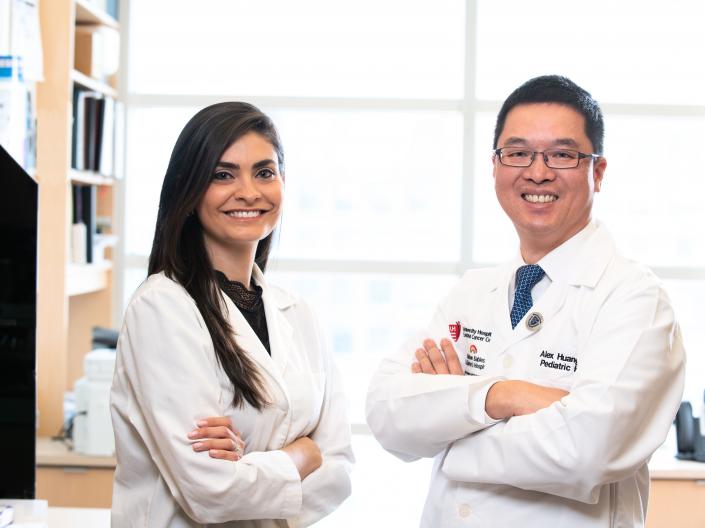 Yami Huerta and Alex Huang standing in lab