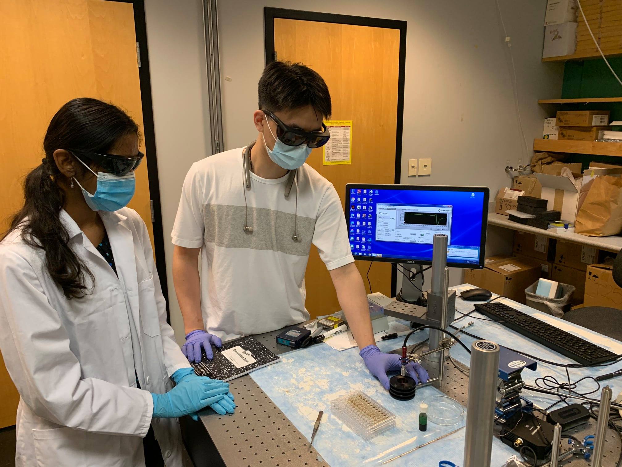 two students doing research in a lab