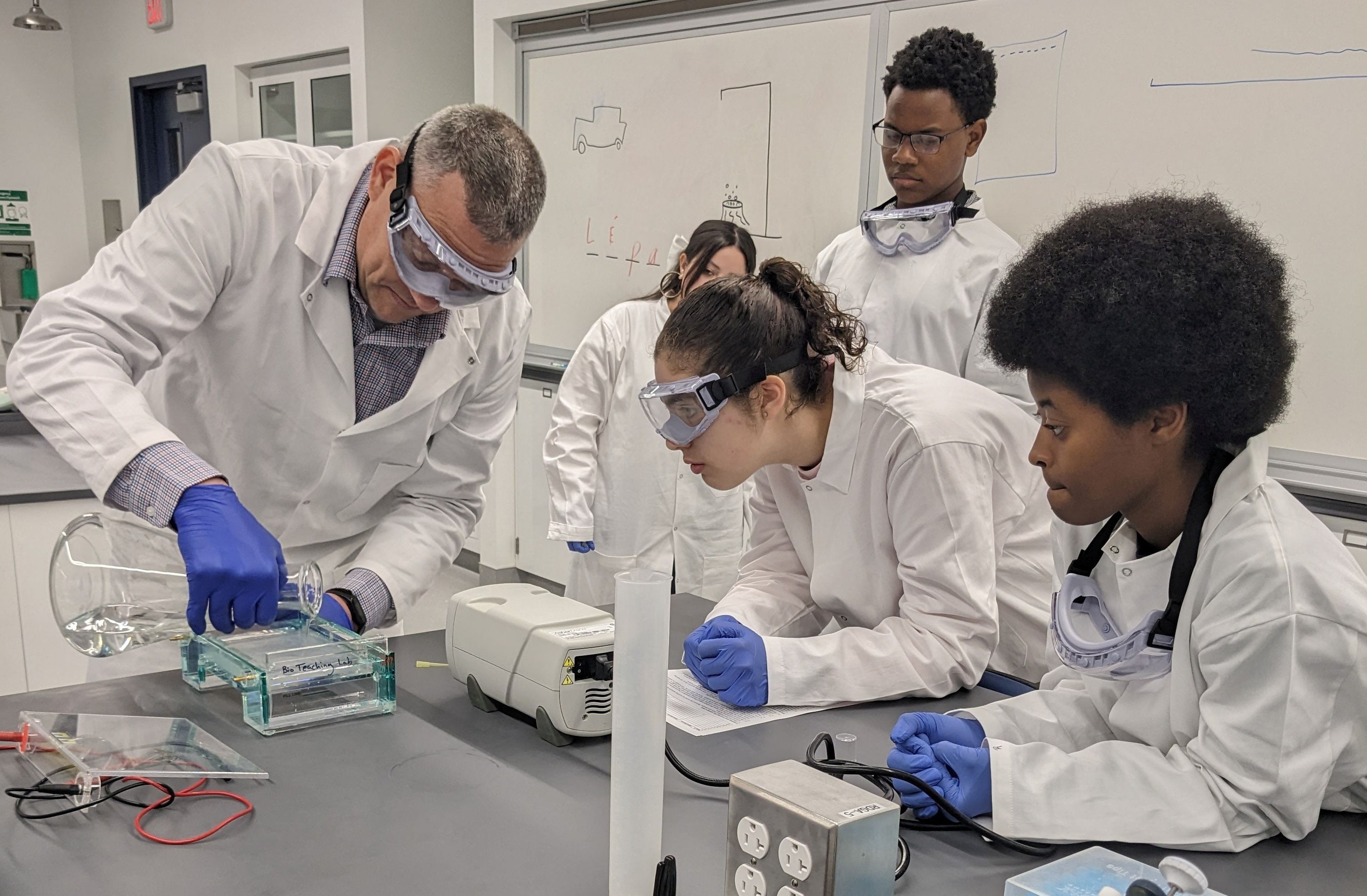 YES students working with a mentor in a lab