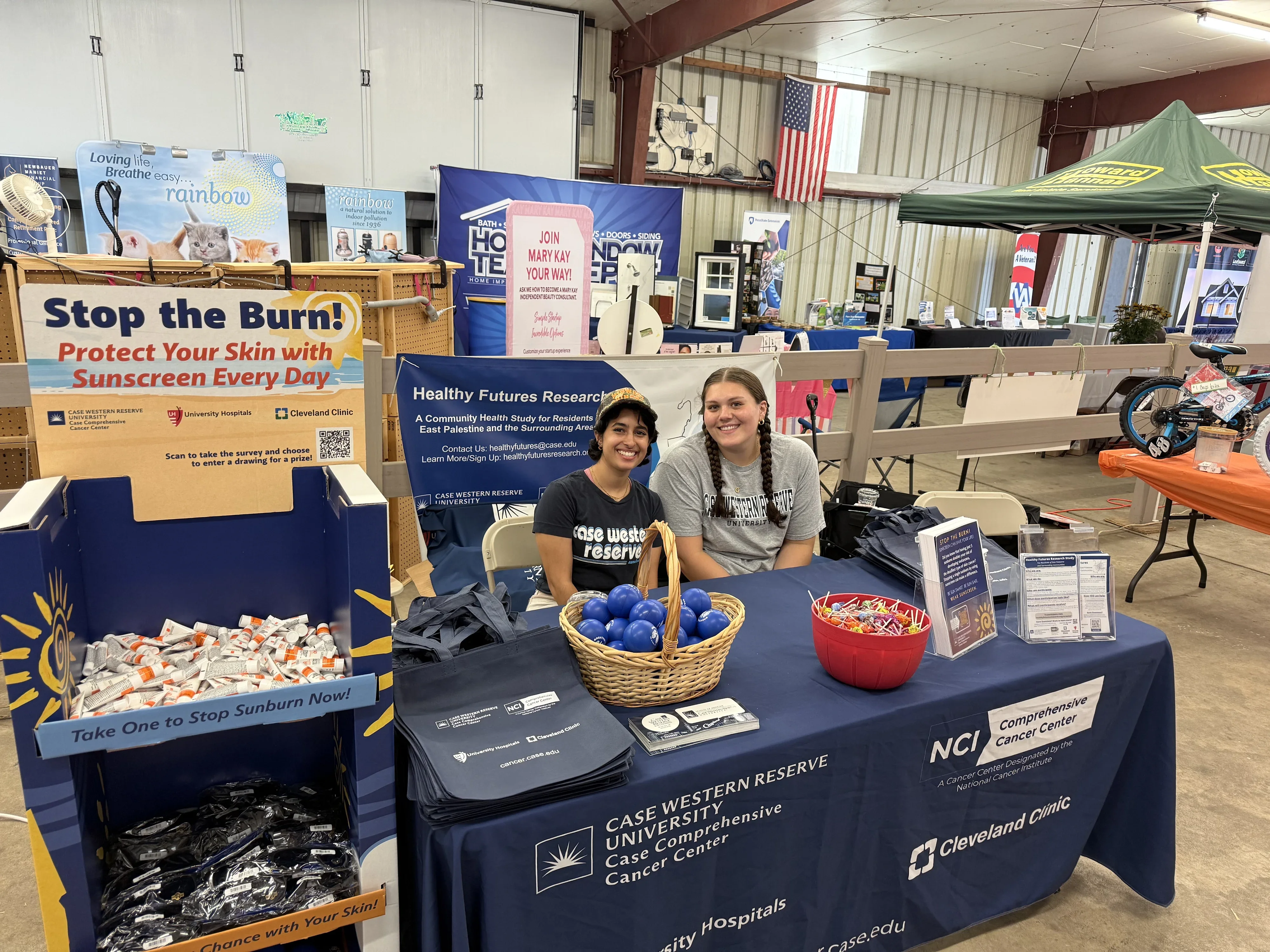 a group of people at a booth at the hookstown county fair