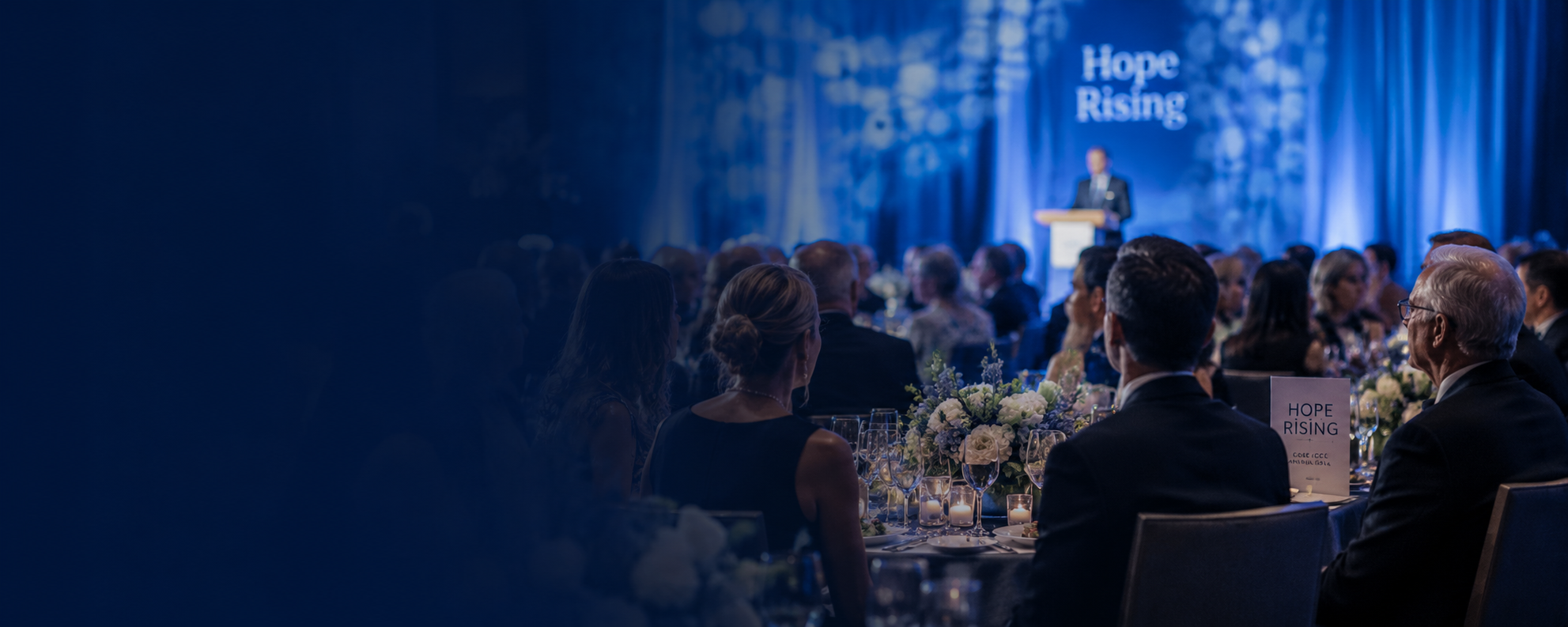 Guests gather at a formal fundraising gala, celebrating and supporting collaborative cancer research in an elegant event setting.