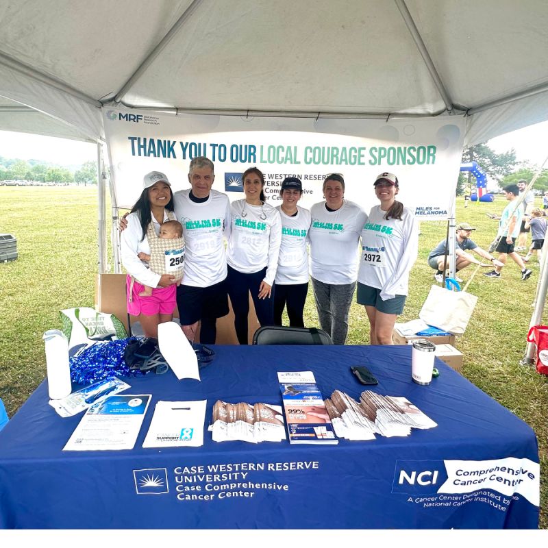 Case CCC team members gather at the Miles for Melanoma 5K booth to support melanoma awareness, prevention, and research
