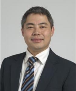 Portrait of Samuel Chao wearing dark suit, white shirt and tie. 