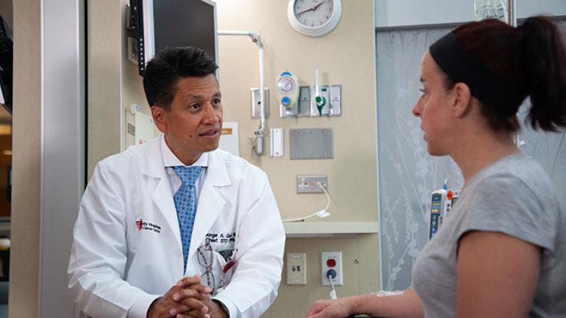 Two people talking in doctor's office