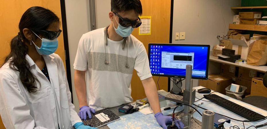 two students doing research in a lab