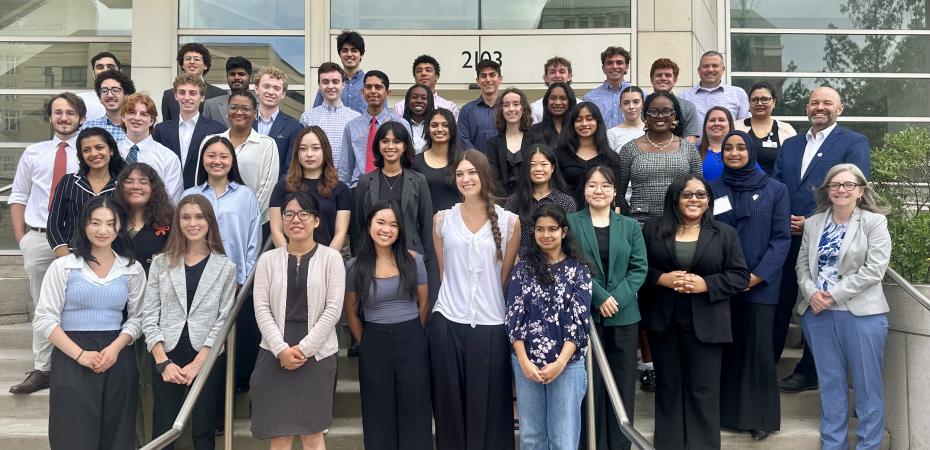 CanSUR 2025 cohort students standing together on the steps in front of the Wolstein Research Building