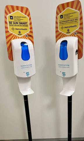 two sunscreen dispensers