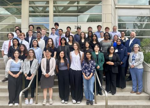 CanSUR 2025 cohort students standing together on the steps in front of the Wolstein Research Building