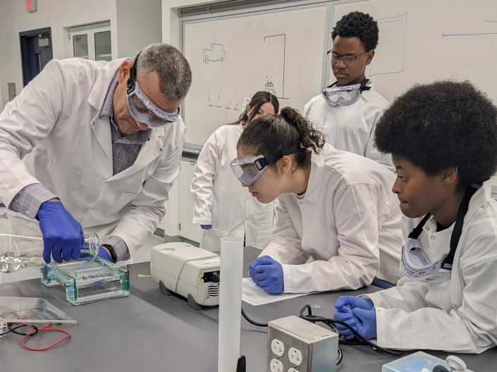 YES students working with a mentor in a lab