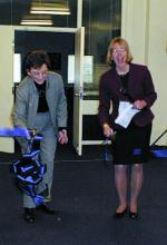 Two women standing at a ribbon cutting ceremony