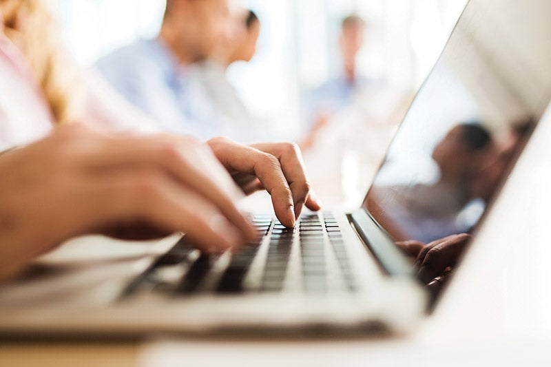 Person typing on a computer