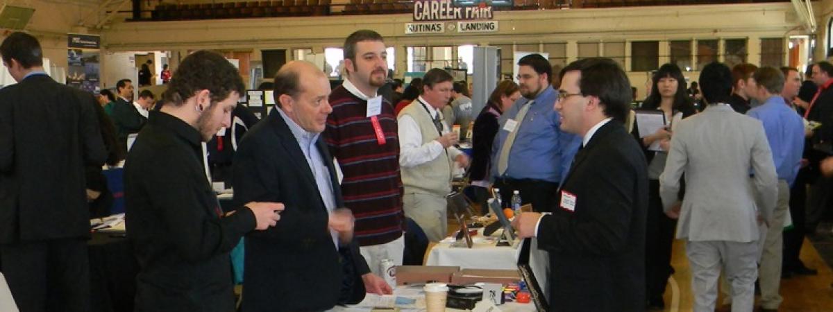 Students interacting with employers at the career fair