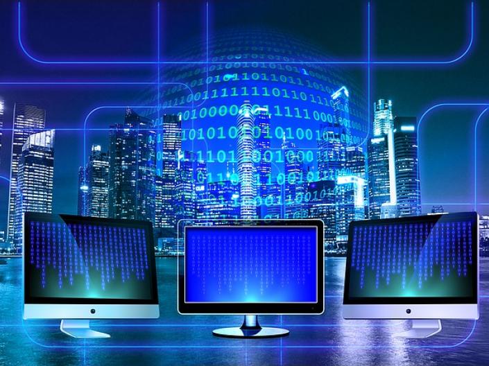 Three Computer Screens with Data