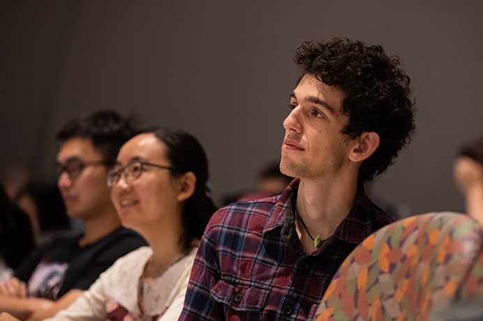 Photo of two Case Western Reserve University Weatherhead School of Management students listening to a lecture