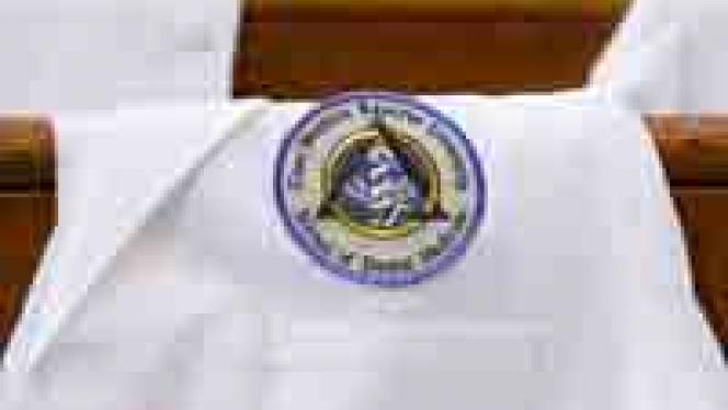 White dental coat with patch