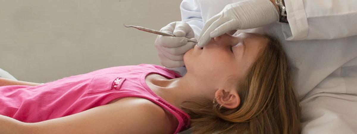 Girl getting a dental examination.