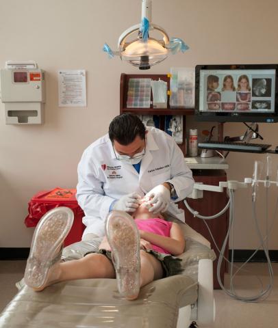 Dentist examining a child