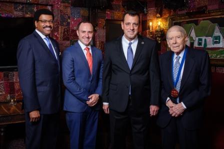 Four men in suits