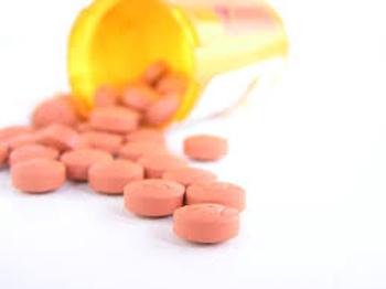 Pills Spilling Out of a Pill Bottle