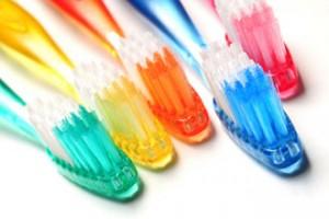 Five, multicolored toothbrushes