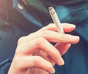 Hand holding a cigarette