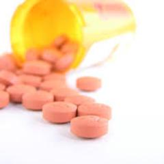 Pills Spilling Out of a Pill Bottle