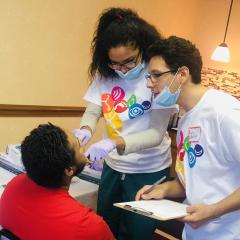 Special Care Dentistry Club members providing dental care