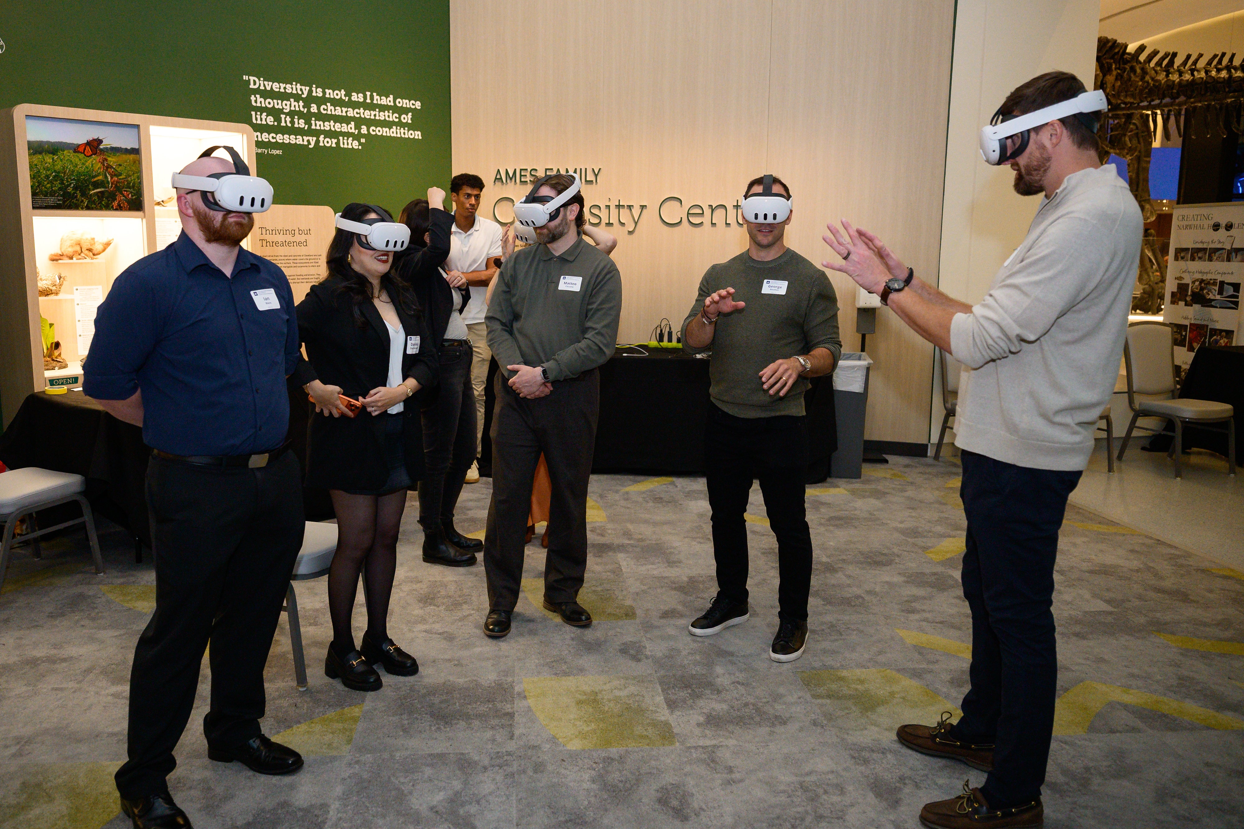 People with VR headsets looking at Narwhal research.