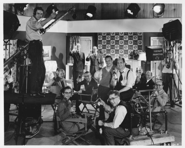 Sherlock Holmes actor Basil Rathbone on the set of a Cinecraft sponsored film for the Carling Brewing Company