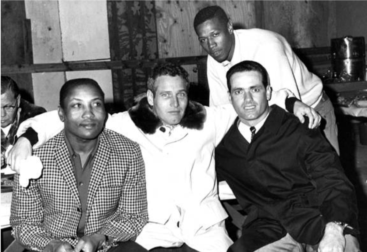 Paul Newman poses with Cleveland Indians players Leon Wagner, Chuck Hinton, and Rocky Colavito, 1966.
