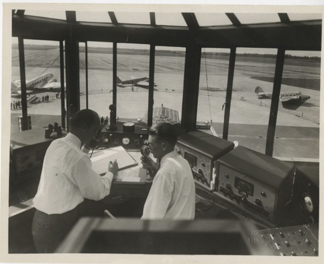 Two 1930s radio control men at work in the Cleveland Municipal Airport.