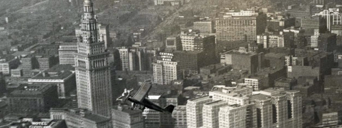 Aerial view of Union Terminal Development and a flying plane in the foreground