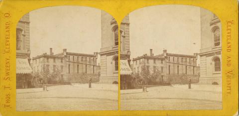 A stereograph of the third Cuyahoga County Jail, with a portion of the Court House visible at the right 