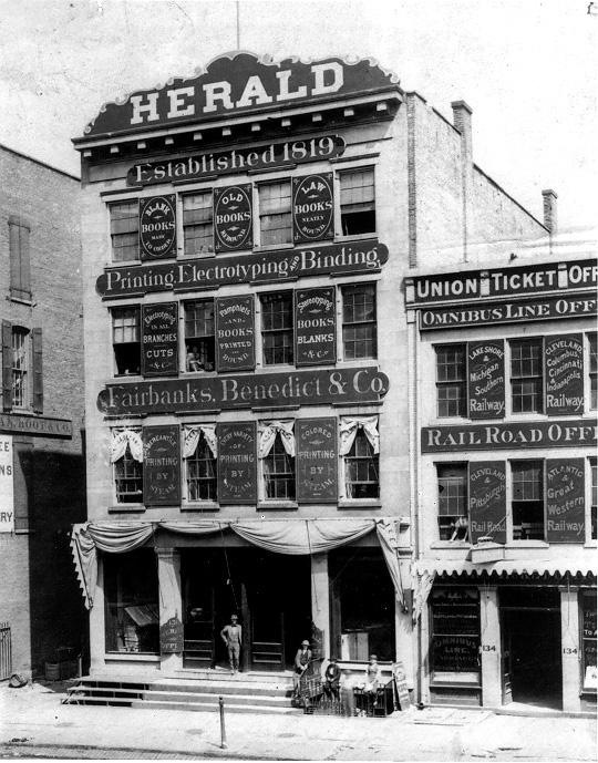 Numerous signs and advertisements adorn the facade of  the Cleveland Herald Building on Bank Street (W. 6th) and Superior Avenue, ca. 1870s. WRHS.