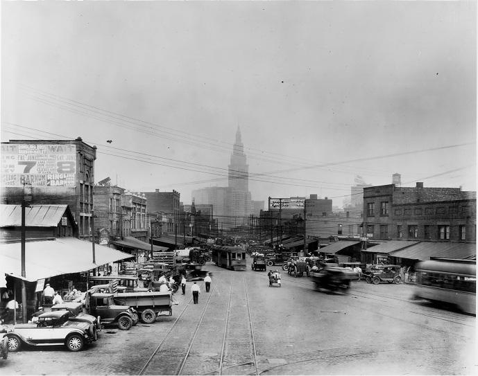 People, trucks and streetcars fill the Haymarket area along Ontario Ave., ca. 1930. The facilities for the Gateway sports complex now occupy much of the site. WRHS.