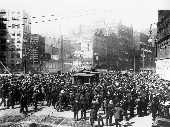 Crowds converge and stop traffic during the streetcar strike of 1899. WRHS.