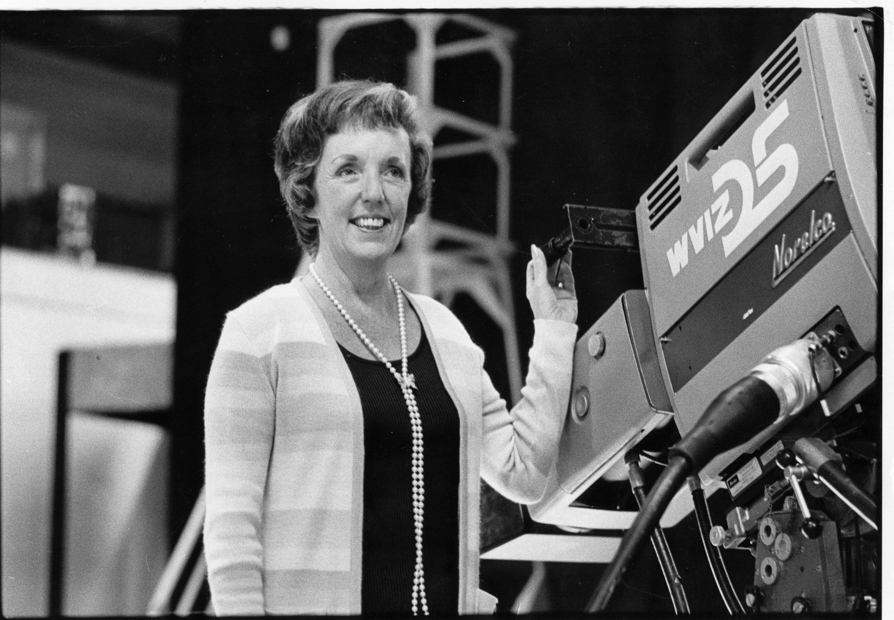 Betty Cope, founding president of WVIZ Channel 25 and television pioneer, with camera on the set of WVIZ.