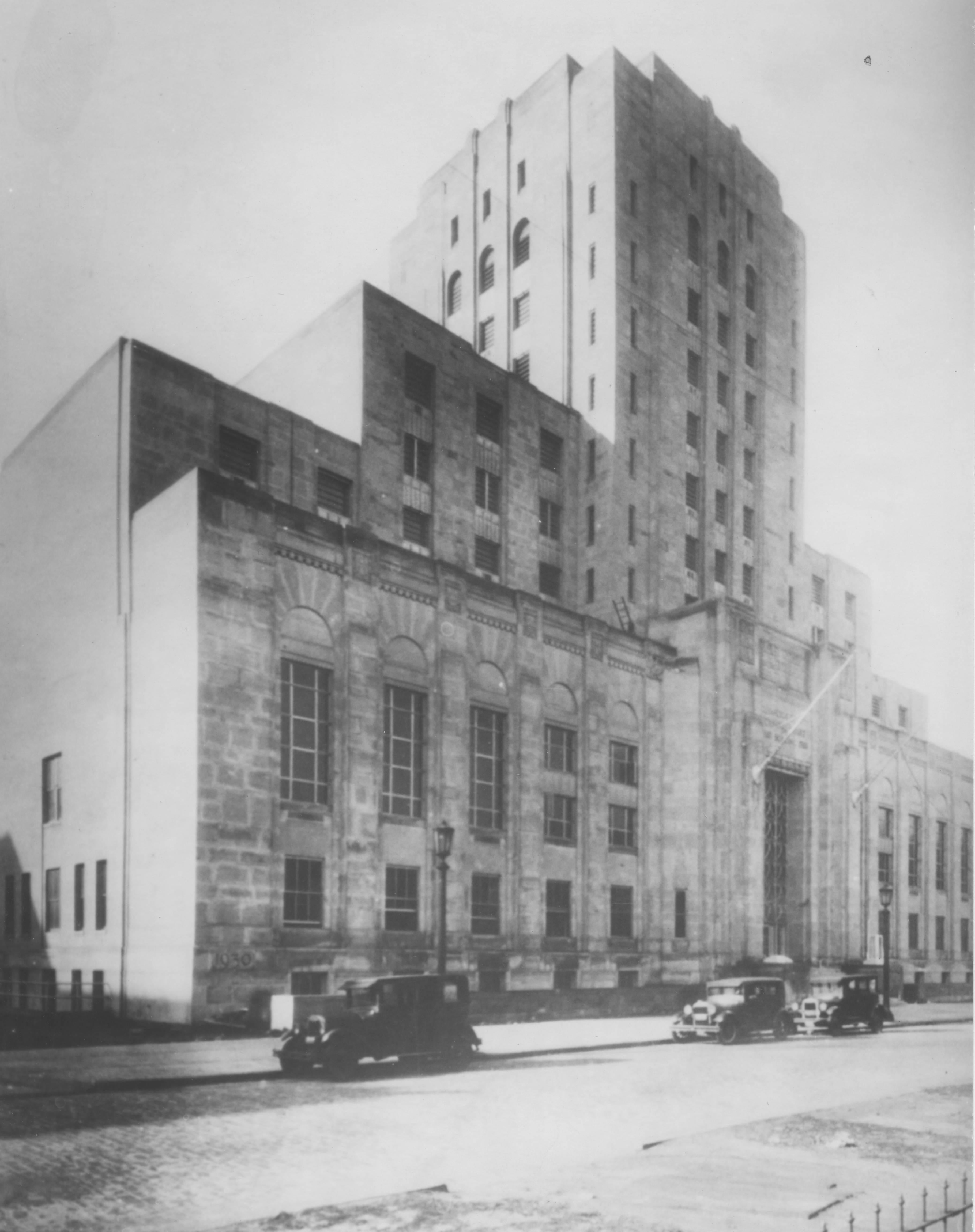 A black and white photo of the Cuyahoga County Jail and Criminal Courts Building in 1931, a towering stone structure.