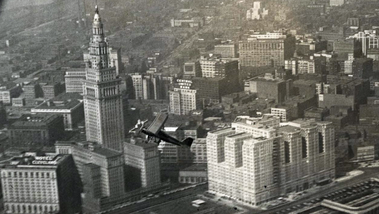 Aerial view of Union Terminal Development and a flying plane in the foreground
