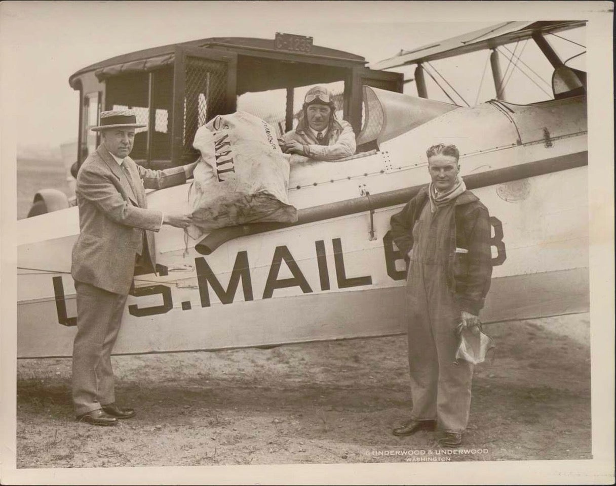 Airmail pilots Clevelander, Shirley J. Short (in plane), and Harry G. Smith on right on June 10, 1927. Short flew airmail between Cleveland and Chicago. Smith covered the Chicago to Omaha route.