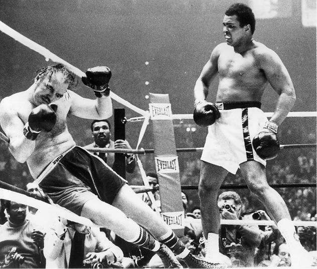 From the Cleveland Press Collection at the CSU Archives, an image of Muhammad Ali watching Chuck Wepner fall to the canvas in the 15th round, 24 Mar. 1975. 