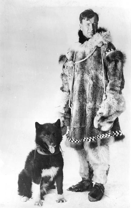 The sled dog Balto, named for explorer Samuel Johansen Balto, stands beside his owner, Gunnar Kasson, ca. 1925. CPL