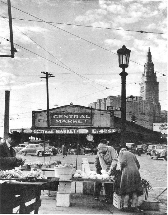 Shoppers look for bargains at dealers’ tables outside the Central Market, E. 4th St., ca. 1946. WRHS