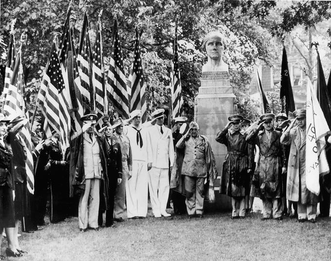 Armed forces personnel bearing flags stand at attention at the dedication ceremonies of the American Cultural Garden, July 1943. Courtesy of the Plain Dealer